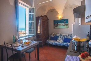 Enjoy a meal with a view of the sea from this well-appointed kitchen and dining area.