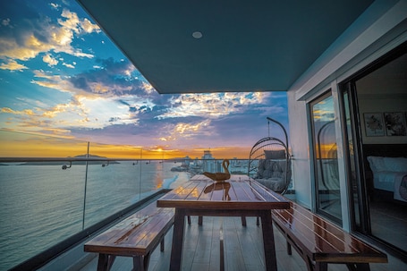 Deluxe Apartment, Beach View | Living area | Flat-screen TV