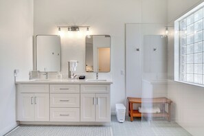 A modern bathroom with a large mirror, two sinks, and a shower. - Heated Pool, Furnished Patio! Gilbert Getaway (Gilbert)