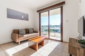 Comfort Apartment, City View | Living area | Flat-screen TV - Sunlit Cozy Apartment (Larnaca)