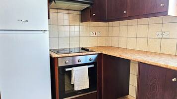 Apartamento Confort, vistas a la ciudad | Cocina privada | Hervidor eléctrico