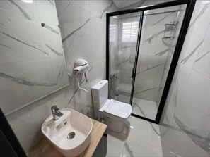Shower, slippers, towels, soap