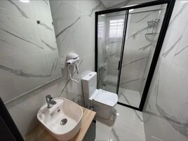 Shower, slippers, towels, soap