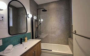 Shower, hair dryer, towels, shampoo
