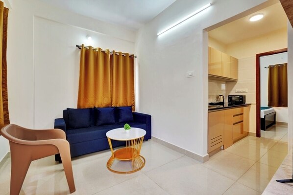 Deluxe House, 1 Queen Bed | Living area | LED TV