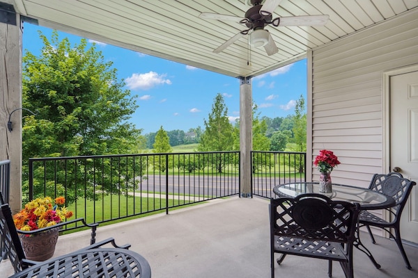 Extended Covered Patio with Nice Seating and a Ceiling Fan