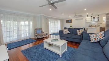 Deluxe House, Multiple Beds, Non Smoking | Living area | 65-inch TV with digital channels