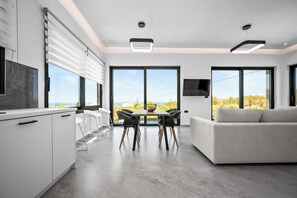 Aetheria Suite | Living area | 32-inch Smart TV with satellite channels