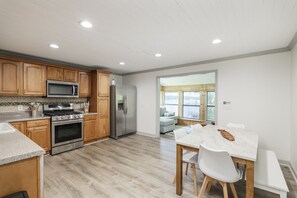 Fridge, stovetop, coffee/tea maker, dining tables