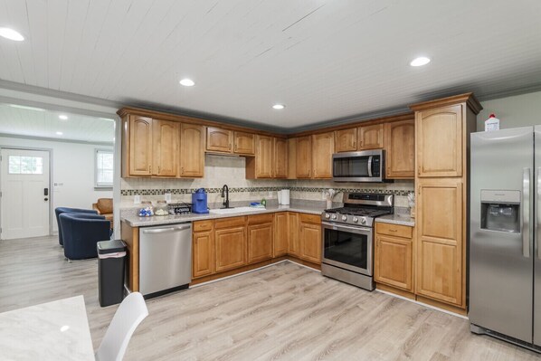 Fridge, stovetop, coffee/tea maker, dining tables