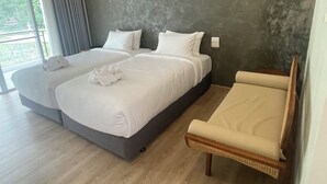 A double bed with white linens, a wooden chair, and a large window with curtains. - DOI LUANG SCENE (Chiang Dao)