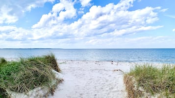 Beach nearby, white sand, sailing