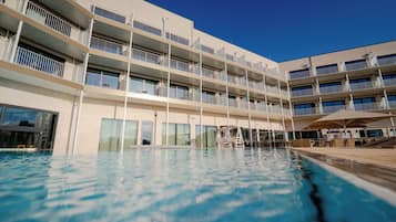 Indoor pool, outdoor pool, pool umbrellas, pool loungers