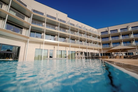 Indoor pool, outdoor pool, pool umbrellas, sun loungers