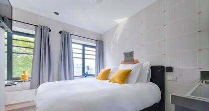 Unique apartment with private kitchen and bathroom, inspired by the abstract art of Lena Milius.
