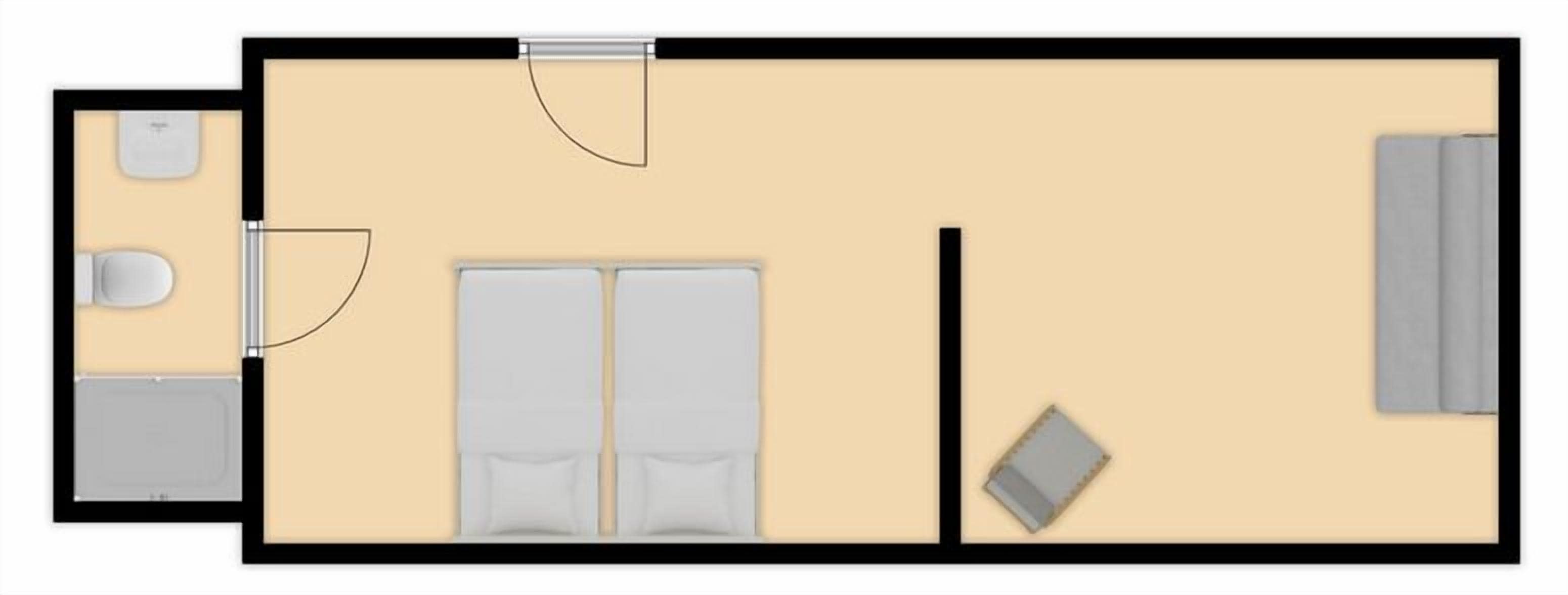 A hotel room layout with a bed, a desk, a chair, a small table, and a wardrobe.