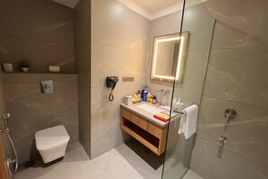 Deluxe Double Room | Bathroom | Hair dryer, slippers, towels, soap - HOTEL HARIVILAS (Bhilwara)