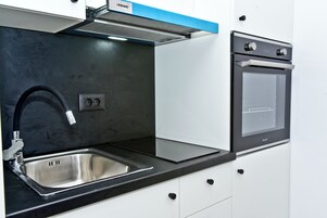 Family Room, Sea View | Private kitchen | Espresso maker, coffee/tea maker, electric kettle