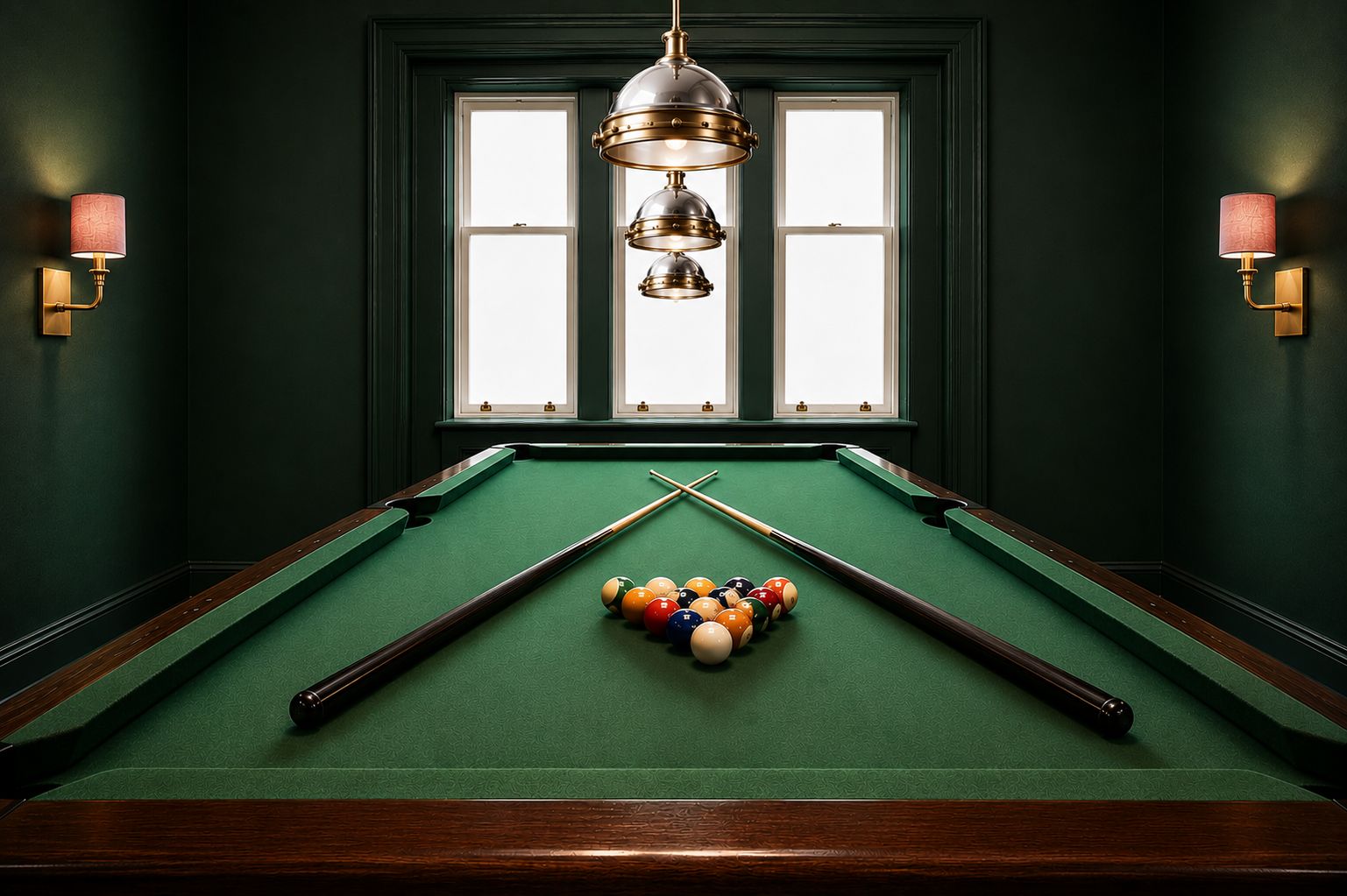 A pool table with balls and cues, two wall-mounted lamps, and a window with blinds.