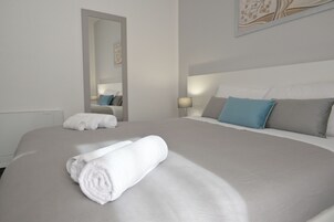 Quarto conforto, vista para a cidade | Camas com colchões de espuma com sistema de memória