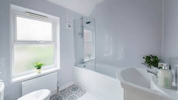 Shower, hair dryer, towels, shampoo