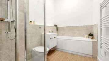 Shower, hair dryer, towels, shampoo