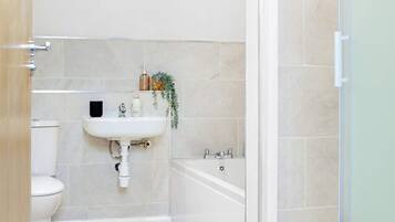 Shower, hair dryer, towels, shampoo
