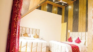 A hotel room with two beds, a ceiling fan, and a wooden ceiling. - Arbiya Villa (Srinagar)