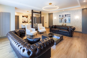 Exclusive Suite, Multiple Beds, Sauna | Living area | 43-inch flat-screen TV with cable channels