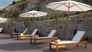 Seasonal outdoor pool, open 8:00 AM to 8:00 PM, pool umbrellas