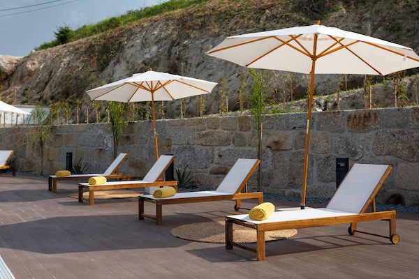 Seasonal outdoor pool, open 8:00 AM to 8:00 PM, pool umbrellas