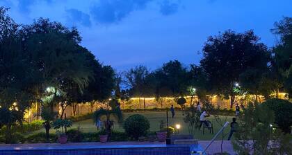 Nestled amidst majestic mountains, our farmhouse offers a serene and picturesque