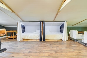 A room with a large bed, a desk, and a chair. - Cozy Altoona Studio w/ Fire Pit: Farm On-site! (Altoona)
