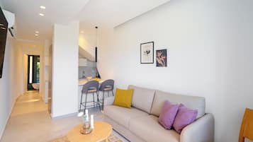 Apartamento design | Área de estar | Smart TV 40 polegadas com canais via satélite