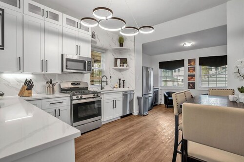 2-Story 4-Bedroom Condo:  3-minute walk to Wrigley Field.  King Bed