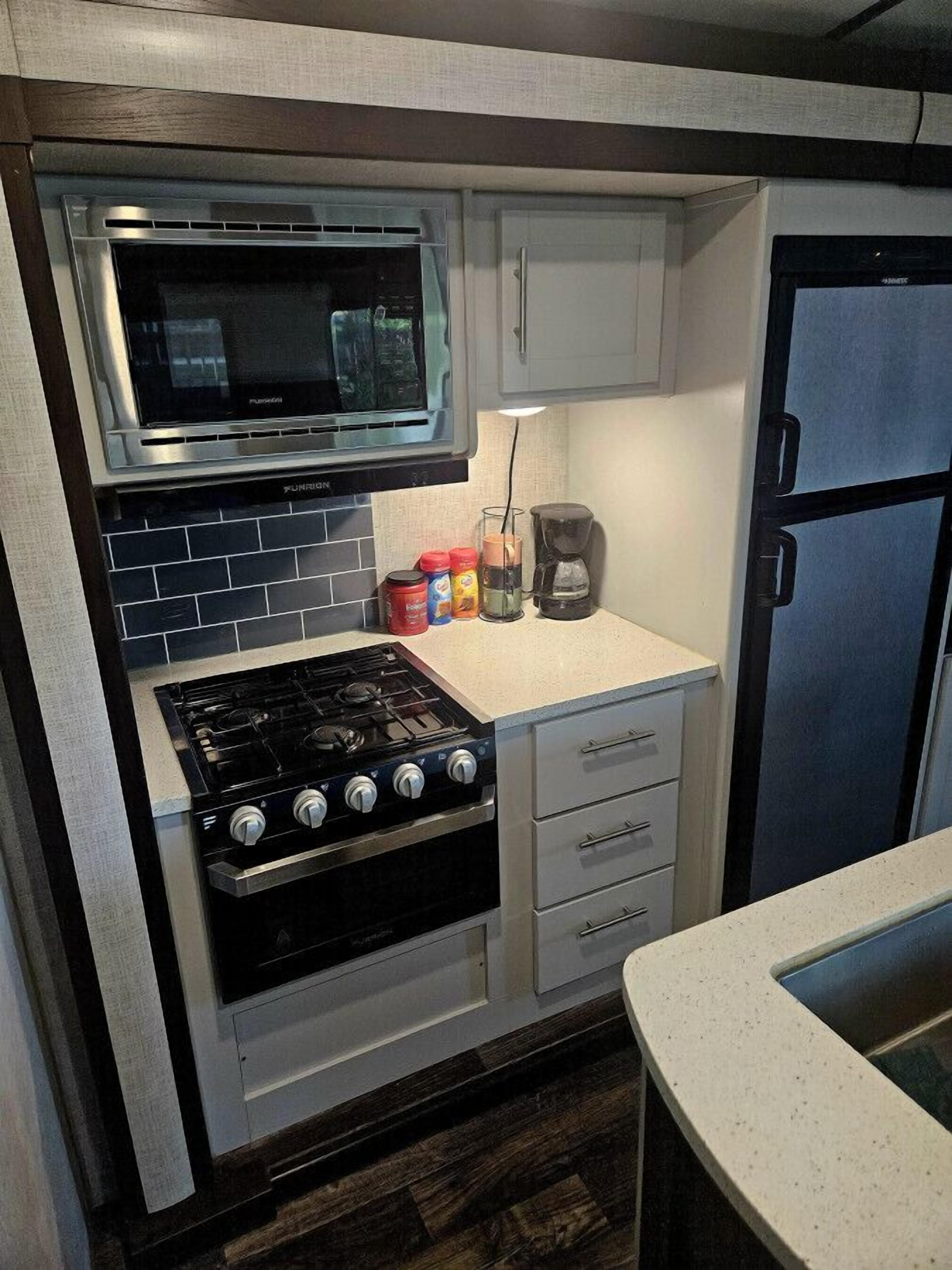 Microwave, stovetop, coffee/tea maker, cookware/dishes/utensils