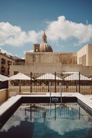 Outdoor pool, open 10:00 AM to 8:00 PM, pool loungers