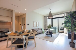 Comfort Apartment, Balcony, Ocean View | Living area | 75-inch Smart TV with cable channels, Netflix, streaming services