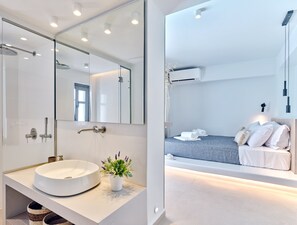 Shower, eco-friendly toiletries, hair dryer, slippers