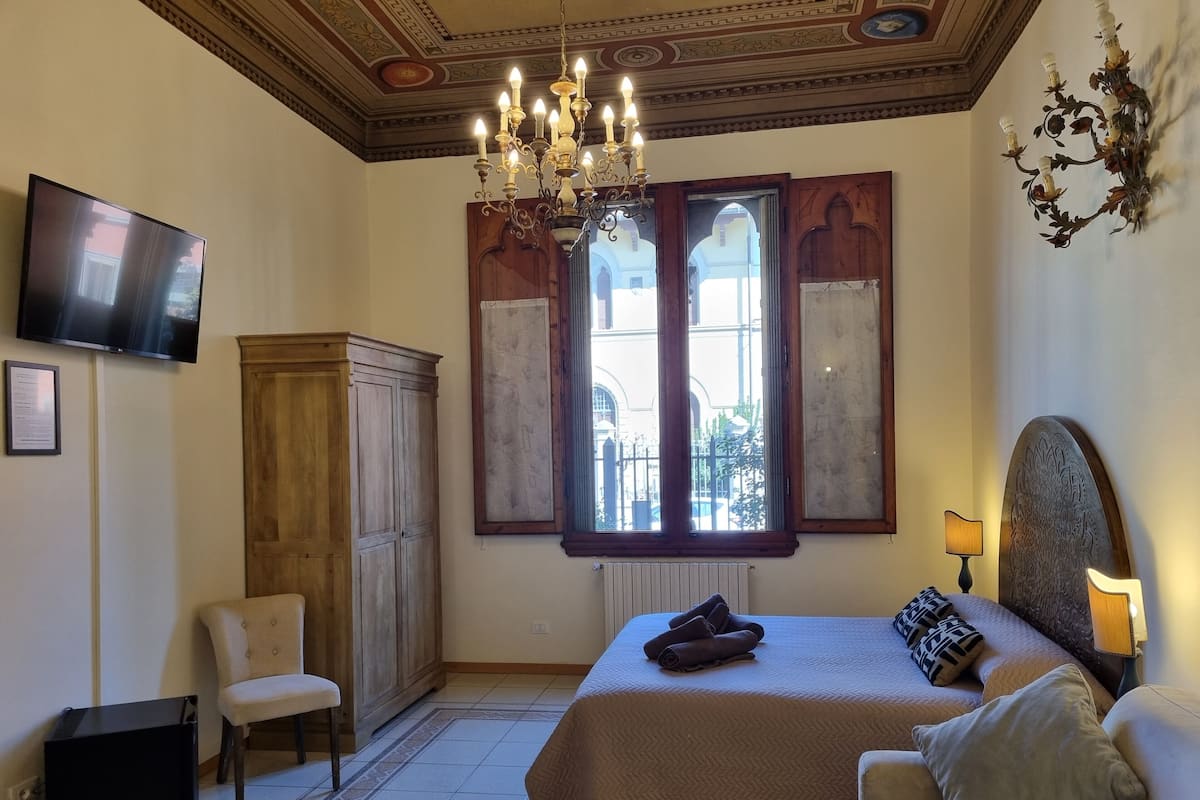 Quadruple Room, Courtyard View | Individually furnished, iron/ironing board, free WiFi, bed sheets