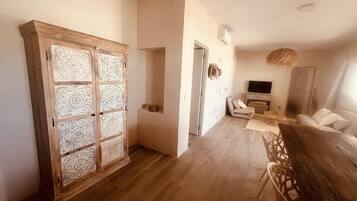 Deluxe House, Garden View | Living area | Flat-screen TV