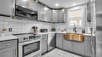 Fridge, stovetop, dishwasher, coffee/tea maker