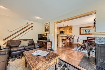 living room looking into kitchen and dining