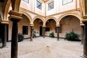 Stunning courtyard with arches and columns, offering unobstructed views of the surrounding area.