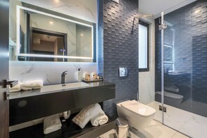 Elite Apartment | Bathroom | Hair dryer, slippers