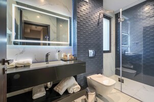 Elite Apartment | Bathroom | Hair dryer, slippers