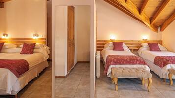 Habitación cuádruple clásica | 1 dormitorio, cortinas opacas, wifi gratis y ropa de cama