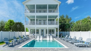 A two-story house with a pool and outdoor seating. - Seaspray: Pool! Sleeps 26! Beach access! (Destin)
