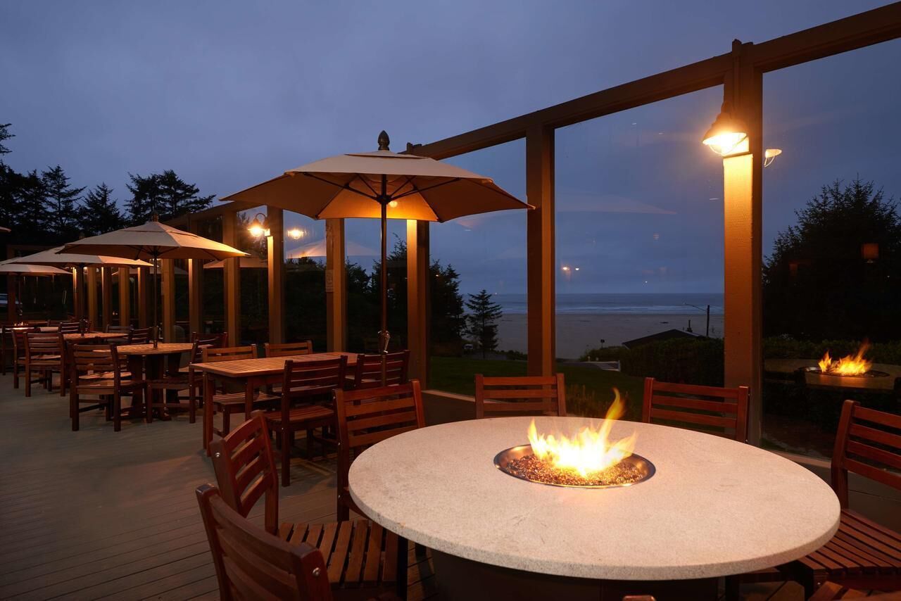 Gather under warm lights and toast by the fire pit.