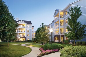 Stunning residential building with a symmetrical facade and beautifully landscaped surroundings.